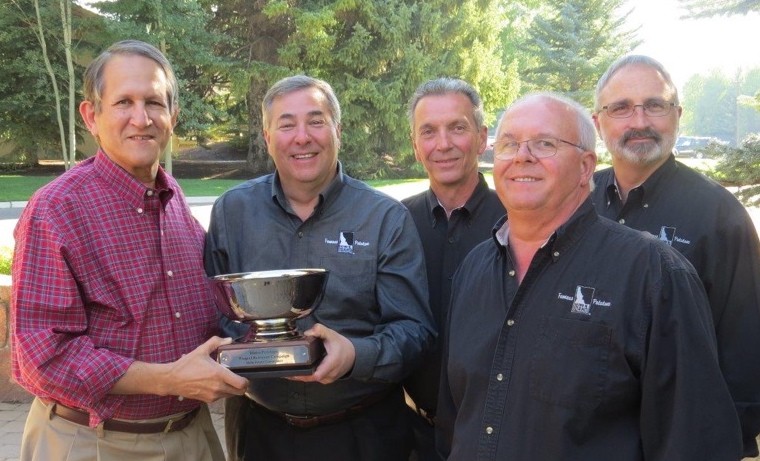 From left: Eric Nieman, associate publisher of Produce Business, presented the Produce Business Marketing Excellence Award to Seth Pemsler, vice president, Retail/International, IPC, and Retail Promotion Directors Kent Beesley, Ken Tubman and Bill Savilonis.